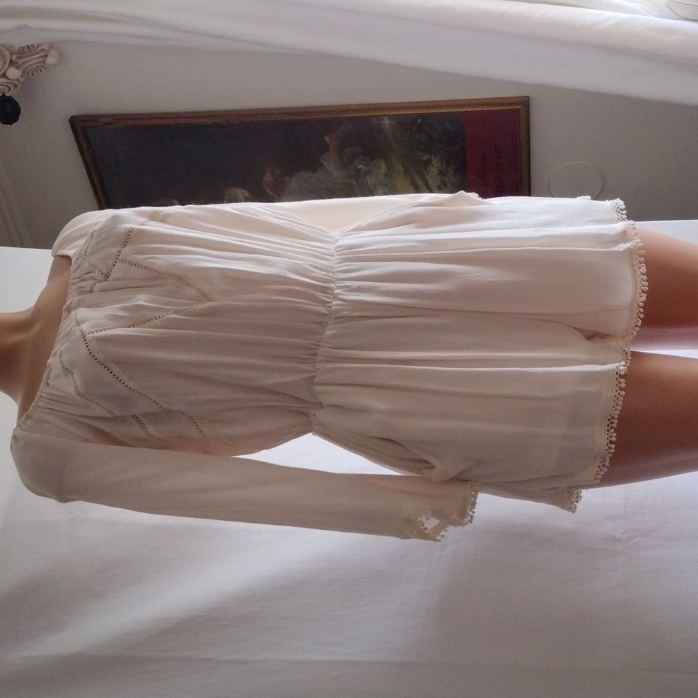 Romeo and Juliet couture cream romper size L.